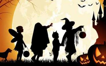 Halloween themed picture of kids in bright moonlight